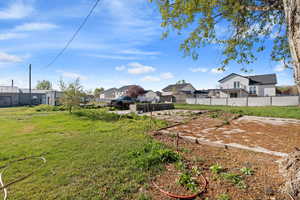 View of yard featuring a patio area and a residential view