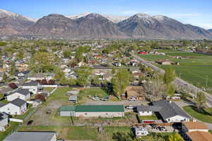 Aerial view of property's location with mountains and nearby suburban area