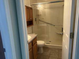 Bathroom featuring vanity and a stall shower
