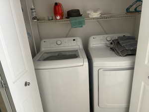 Laundry area with washing machine and clothes dryer