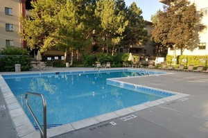 Community pool featuring a patio area