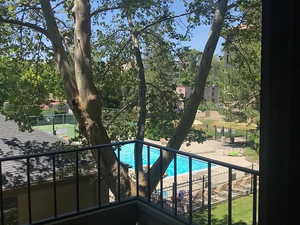 Community pool with a balcony