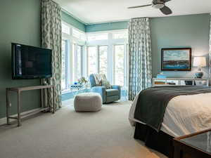 Master Bedroom, plush carpeting with a ceiling fan, auto draperies, and fireplace.