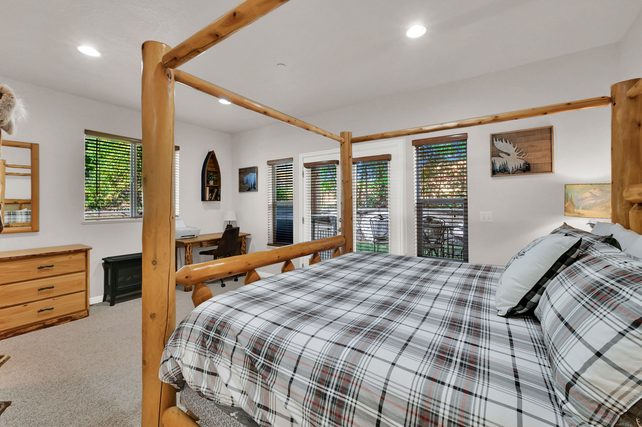 Bedroom featuring light carpet, recessed lighting, and access to outside