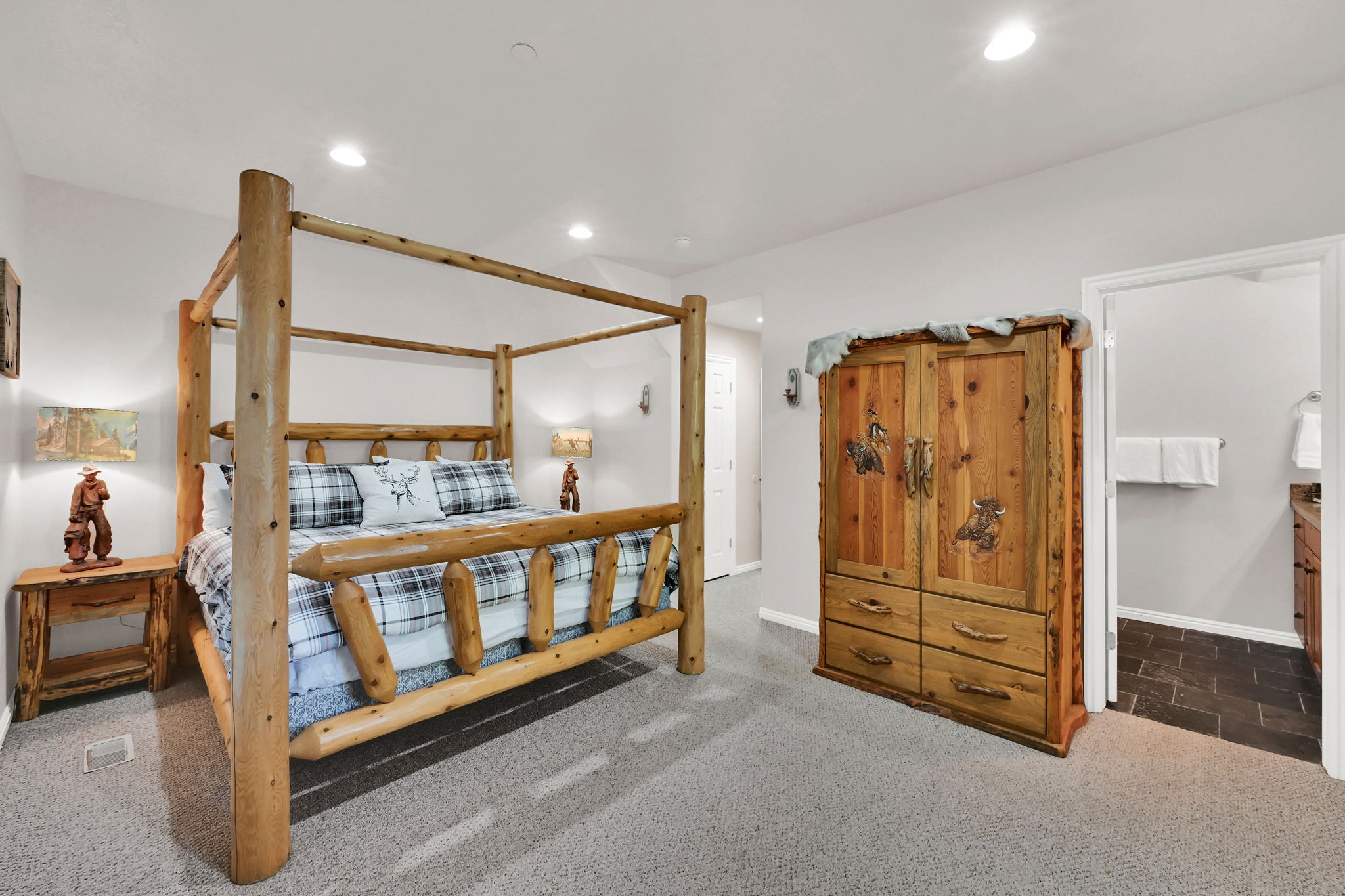 Bedroom with dark carpet and recessed lighting