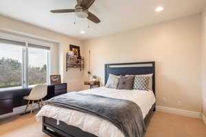 Bedroom 2 with light carpet, recessed lighting, a ceiling fan, and an office area