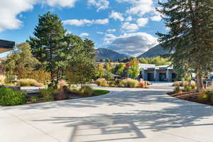 View of concrete driveway featuring a mountain view