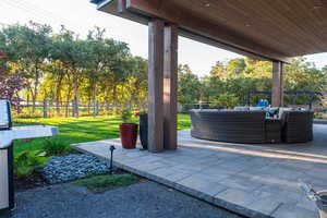 Fenced backyard featuring an outdoor lounge area and a patio area