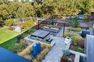 View of yard with a patio and a vegetable garden
