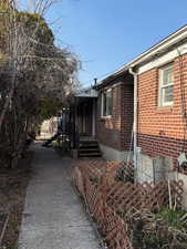 View of side of home with brick siding