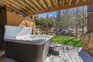 View of patio featuring a hot tub