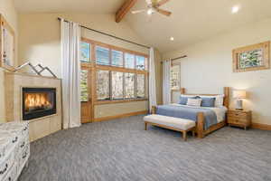 Bedroom featuring a fireplace, dark carpet, recessed lighting, and a ceiling fan