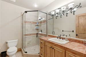 Bathroom with vanity and a stall shower