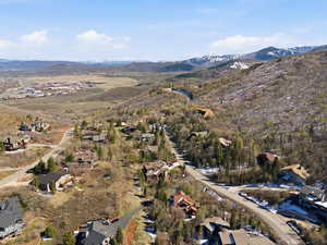 Aerial perspective of suburban area with a mountainous background