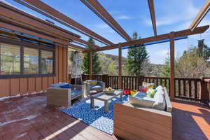 Wooden deck with an outdoor living space