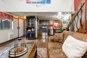 Living area featuring dark wood-style flooring