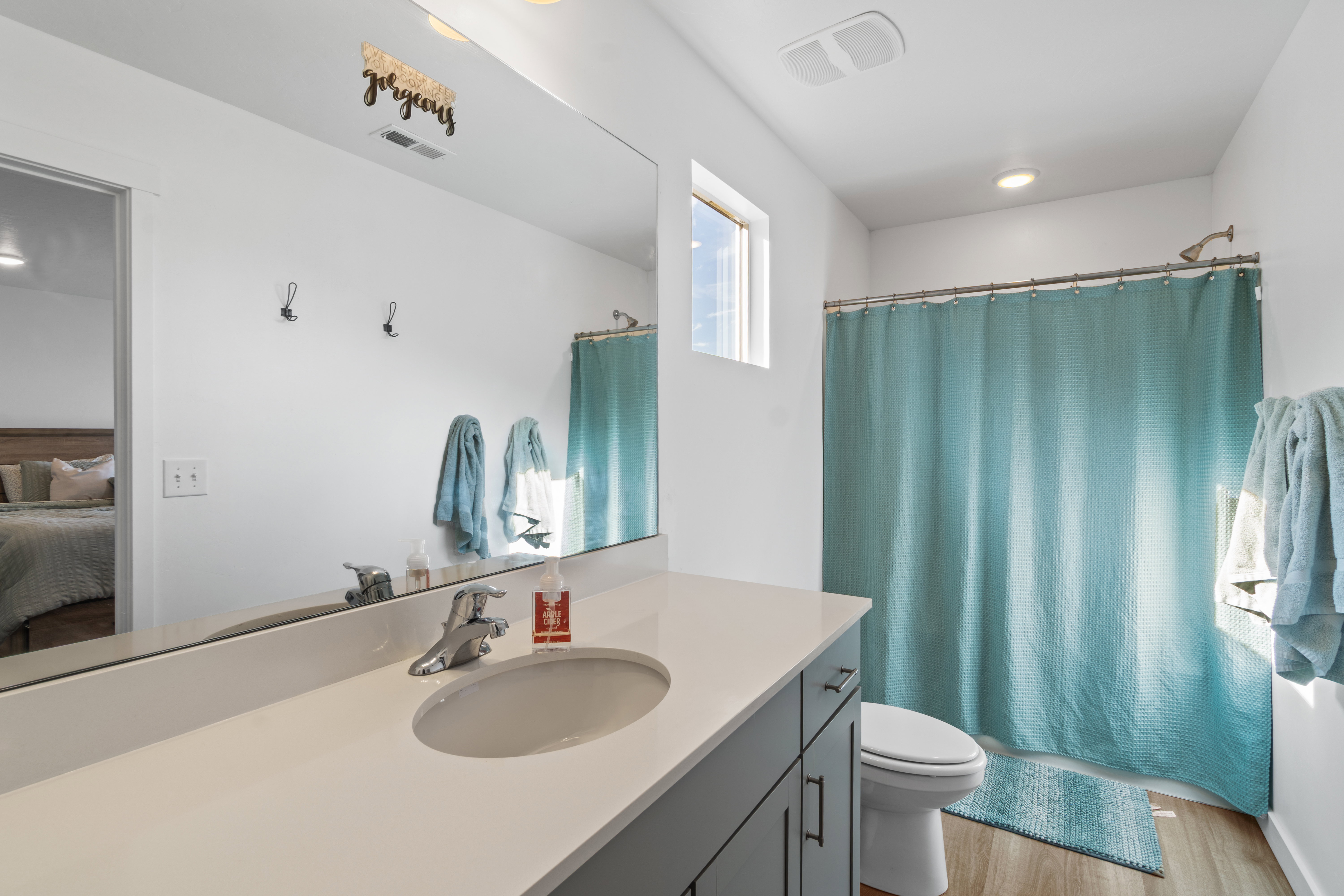 Bathroom with vanity, shower / tub combo