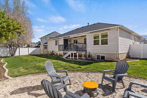 Rear view of house with a patio, a fenced backyard, a gate, and a deck