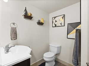 Bathroom with a textured ceiling and vanity
