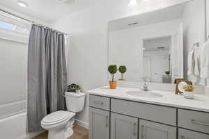 Full bathroom featuring vanity, shower / tub combo