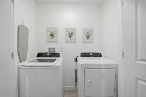 Laundry area featuring separate washer and dryer