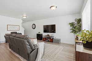 Living area featuring light wood finished floors