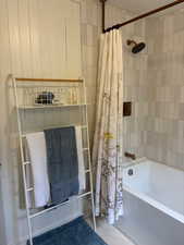 Full bathroom with shower / tub combo