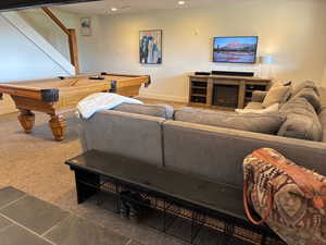 Carpeted living area featuring billiards, a fireplace, recessed lighting, and tile patterned flooring