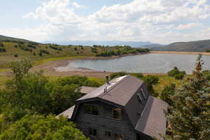 View from above of property featuring a water and mountain view
