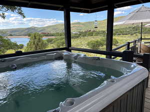 Exterior view of a hot tub and mountains