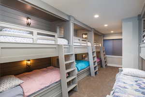 Bedroom featuring light colored carpet and recessed lighting