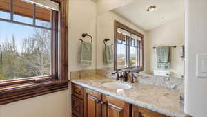 Half bathroom featuring vanity