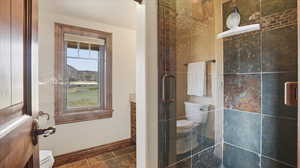 Full bathroom featuring stone tile floors and vanity