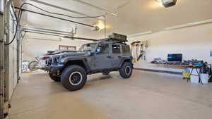 Garage featuring a garage door opener