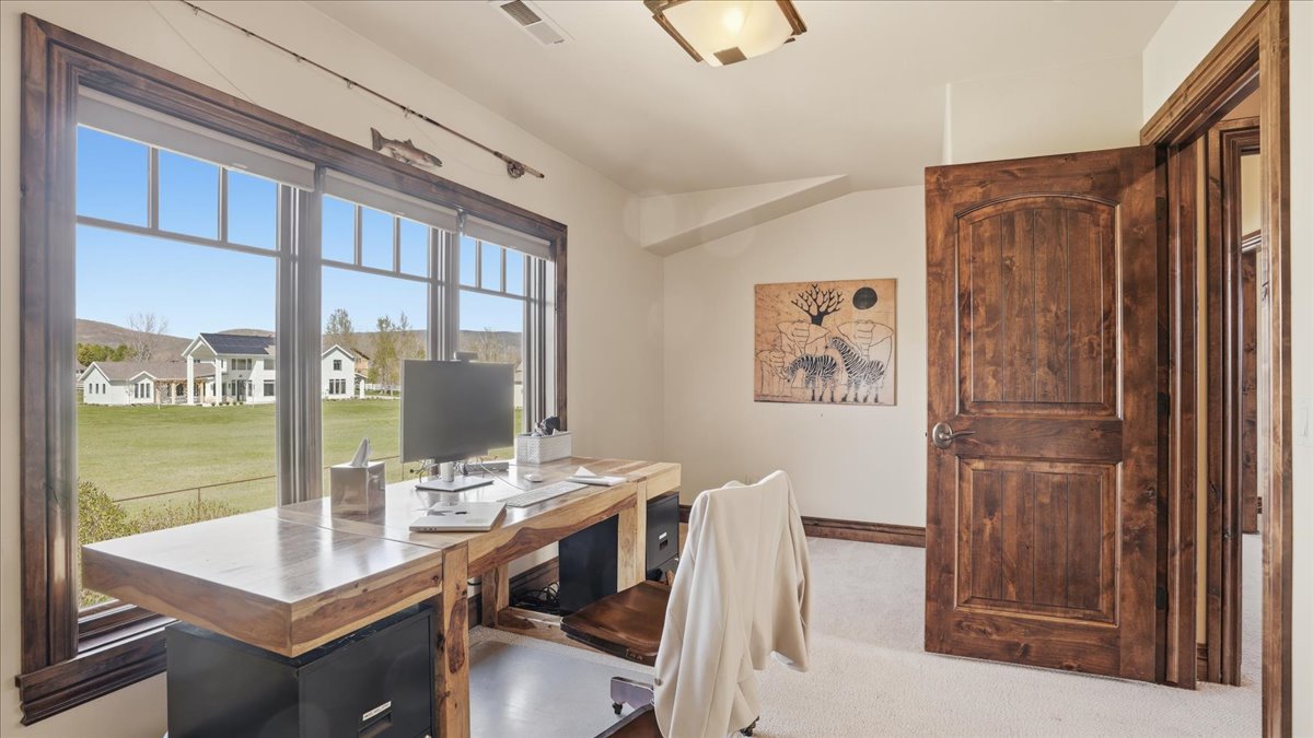 Office with light colored carpet