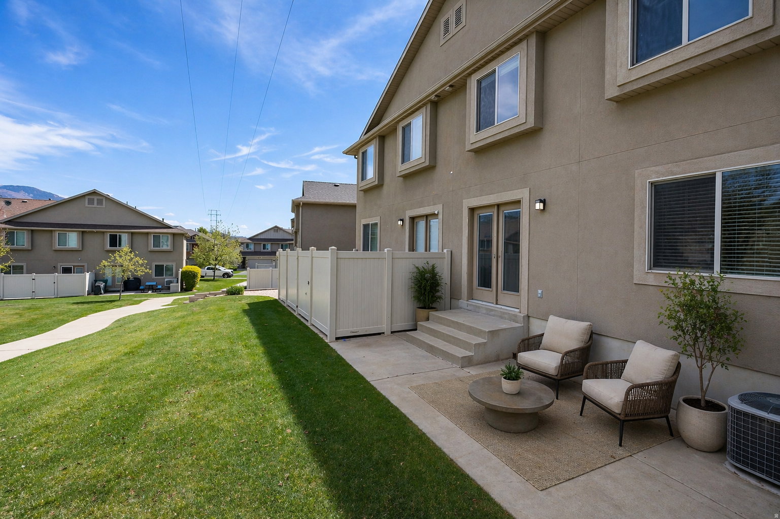 Virtually Staged - View of yard with a residential view, a patio, and french doors