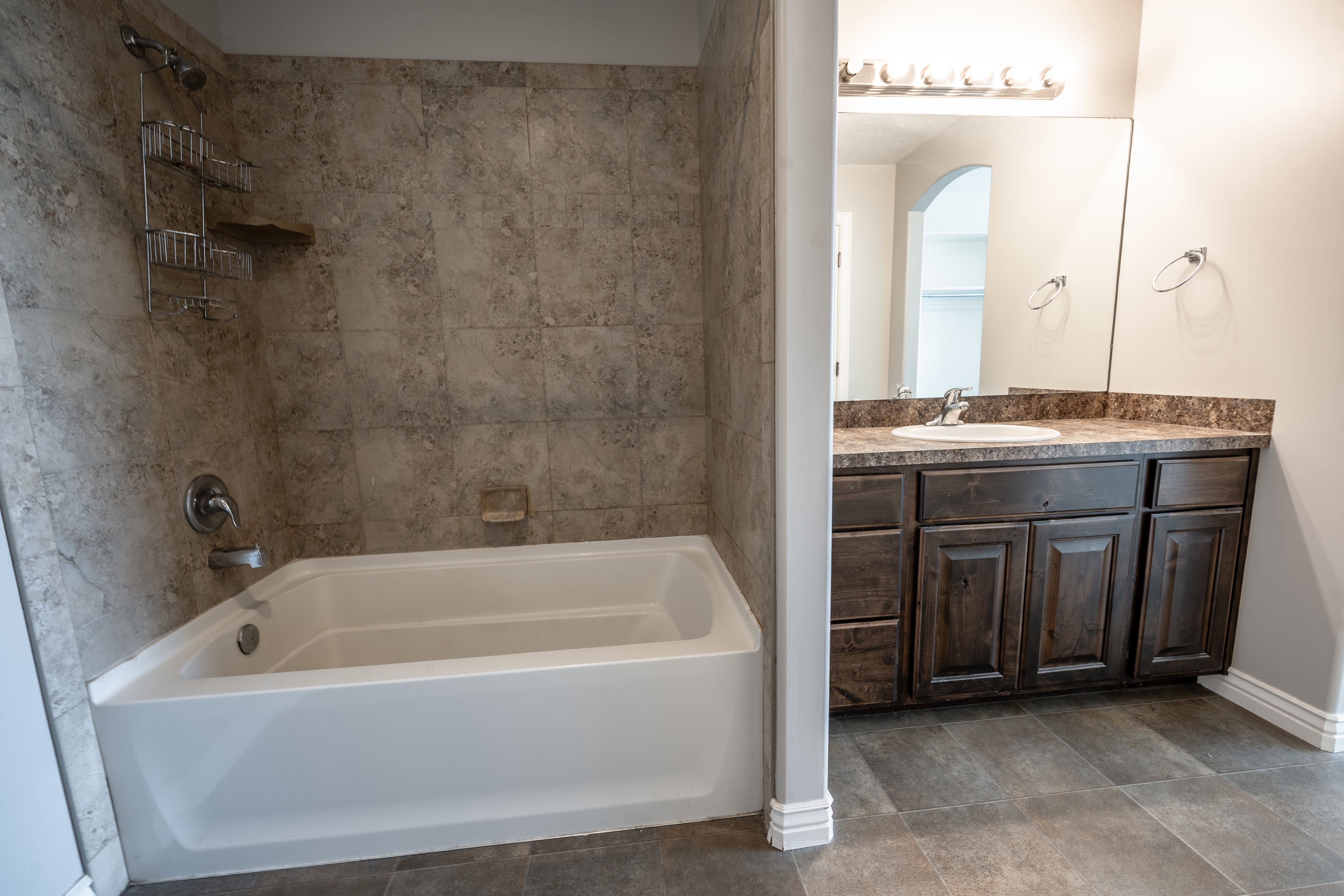 Full bath featuring vanity and shower / bathtub combination