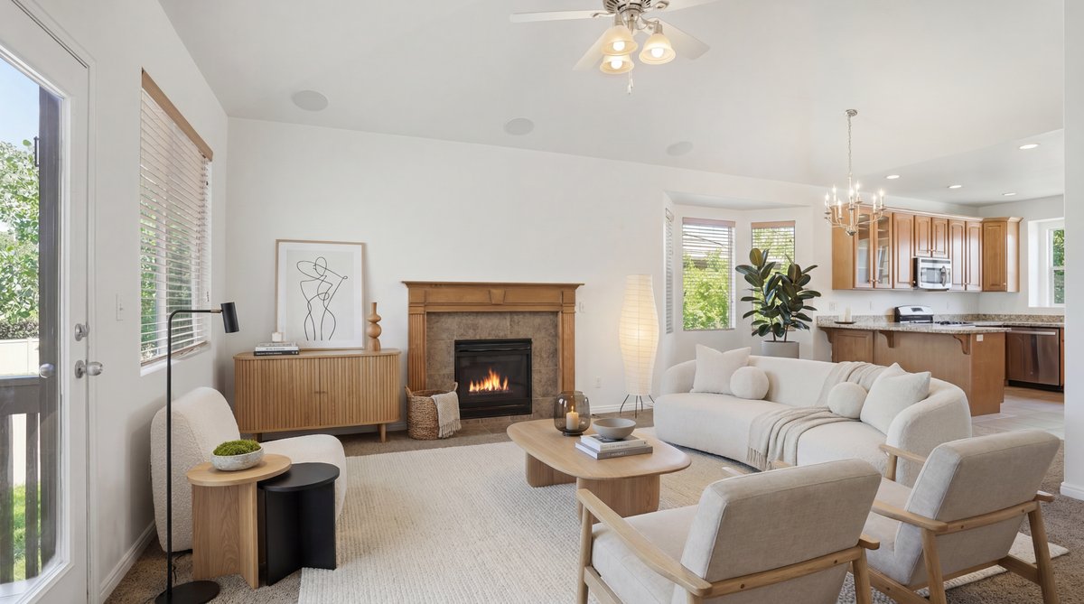 Living area featuring a fireplace with a wood mantel, overhead fan, and recessed lighting