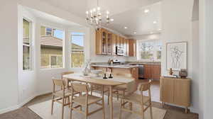 Dining area with light colored carpet and a chandelier