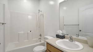 Full bath featuring vanity and  shower combination