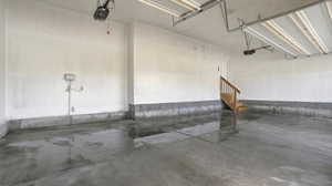 Garage featuring a garage door opener