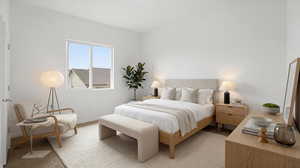 Bedroom with light colored carpet and baseboards