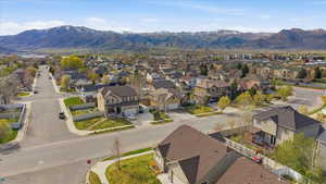 Aerial perspective of suburban area with a mountainous background