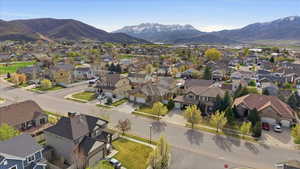 Aerial perspective of suburban area featuring a mountainous background