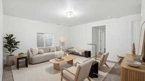 Living room featuring light colored carpet and baseboards