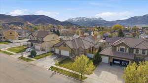 Aerial perspective of suburban area featuring a mountainous background