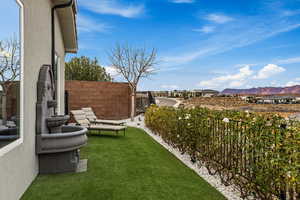 View of yard with a mountain view and a patio area