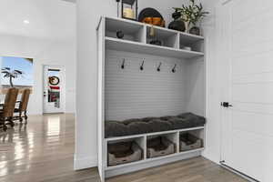 Mudroom featuring light wood-style floors and recessed lighting
