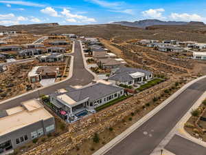 Aerial perspective of suburban area featuring a mountainous background