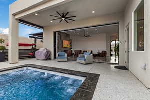 Swimming pool featuring a patio, area for grilling, outdoor furniture, and a hot tub
